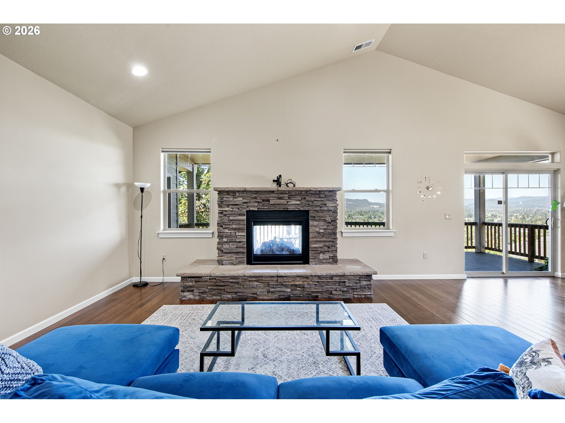 6451 Dogwood Street Springfield, OR 97478 - Photo 4 of 38 a living room with furniture a fireplace and a wooden floor