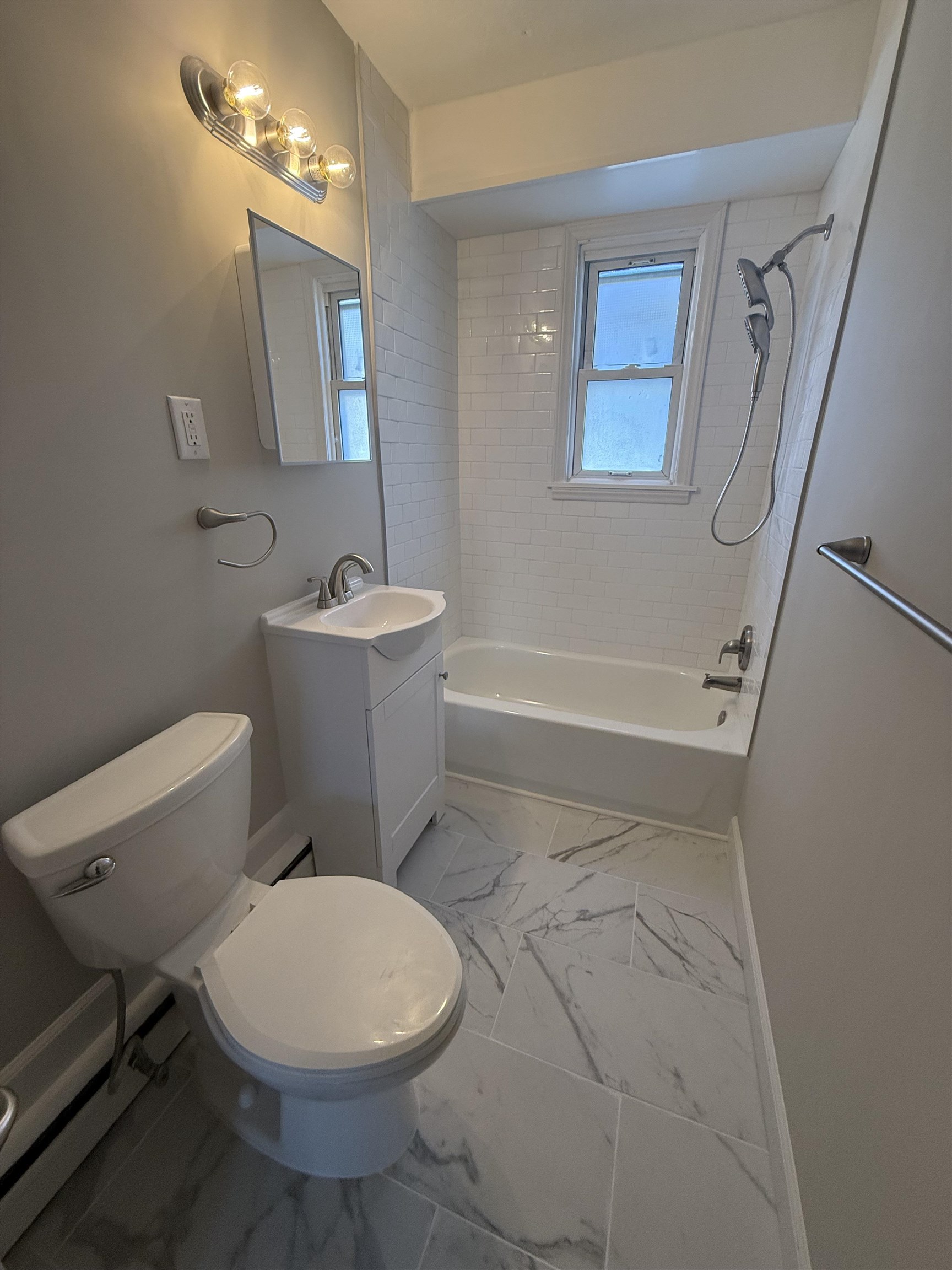 110 West Crocus Road, Unit 2 Wildwood Crest, NJ 08260 - Photo 3 of 8 a bathroom with a toilet a sink and bathtub