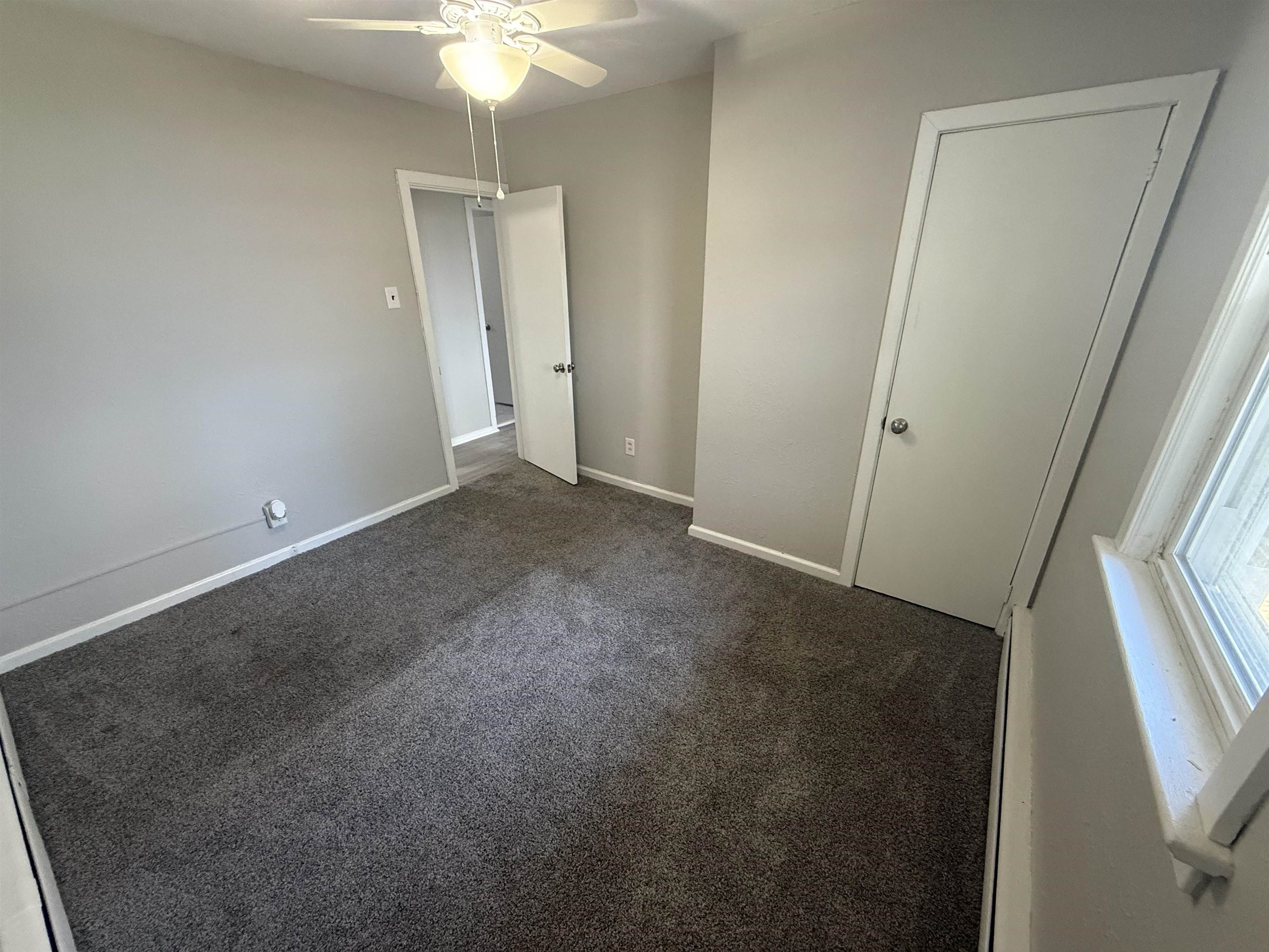 110 West Crocus Road, Unit 2 Wildwood Crest, NJ 08260 - Photo 7 of 8 an empty room with windows and entrance