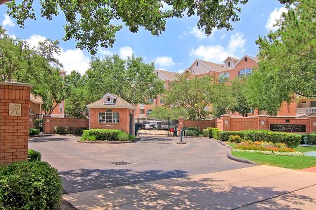 a front view of a house with a yard and a garage