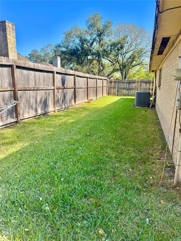 a view of backyard with green space