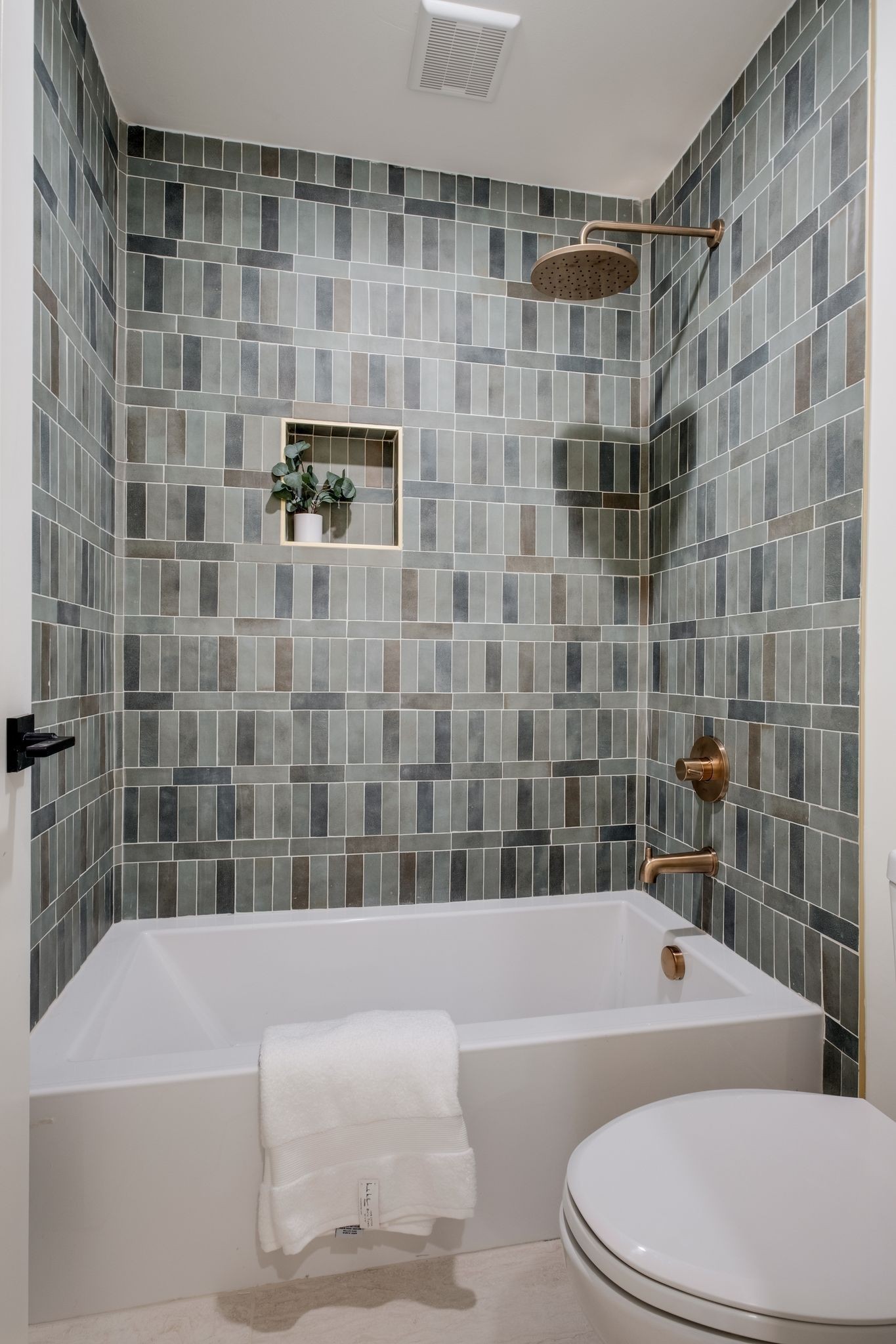 1510 East Piney Road Dickson, TN 37055 - Photo 47 of 66 a bathroom with a white bath tub a toilet and a shower