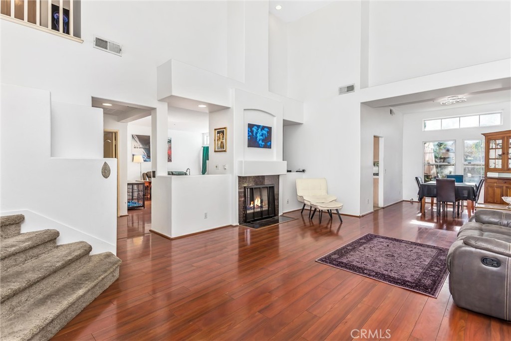 11621 Pavia Drive Rancho Cucamonga, CA 91701 - Photo 7 of 36 Large living room with fireplace & cathedral ceiling