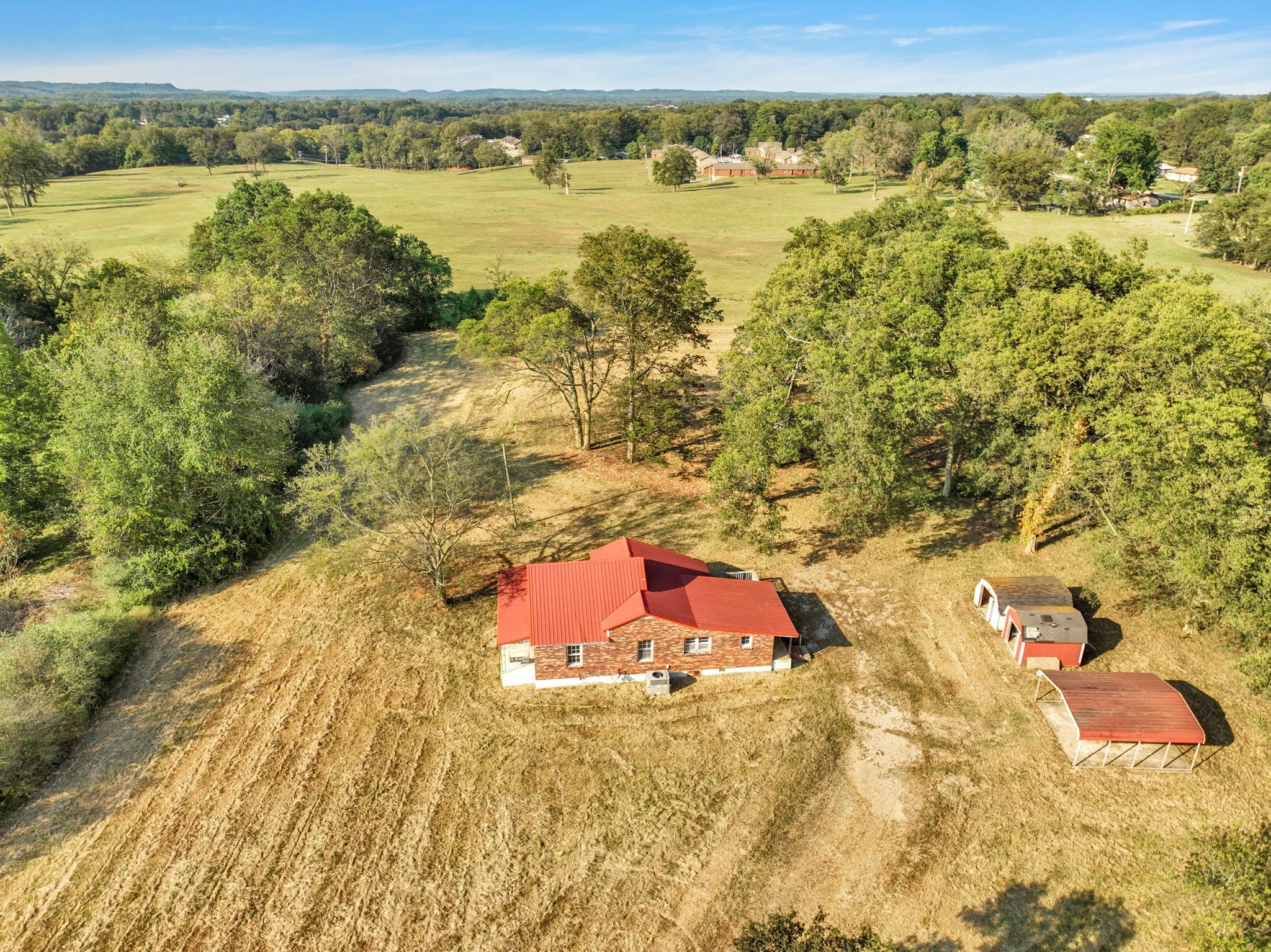 535 Scott Road Mount Pleasant, TN 38474 - Photo 24 of 40 an aerial view of residential houses with outdoor space