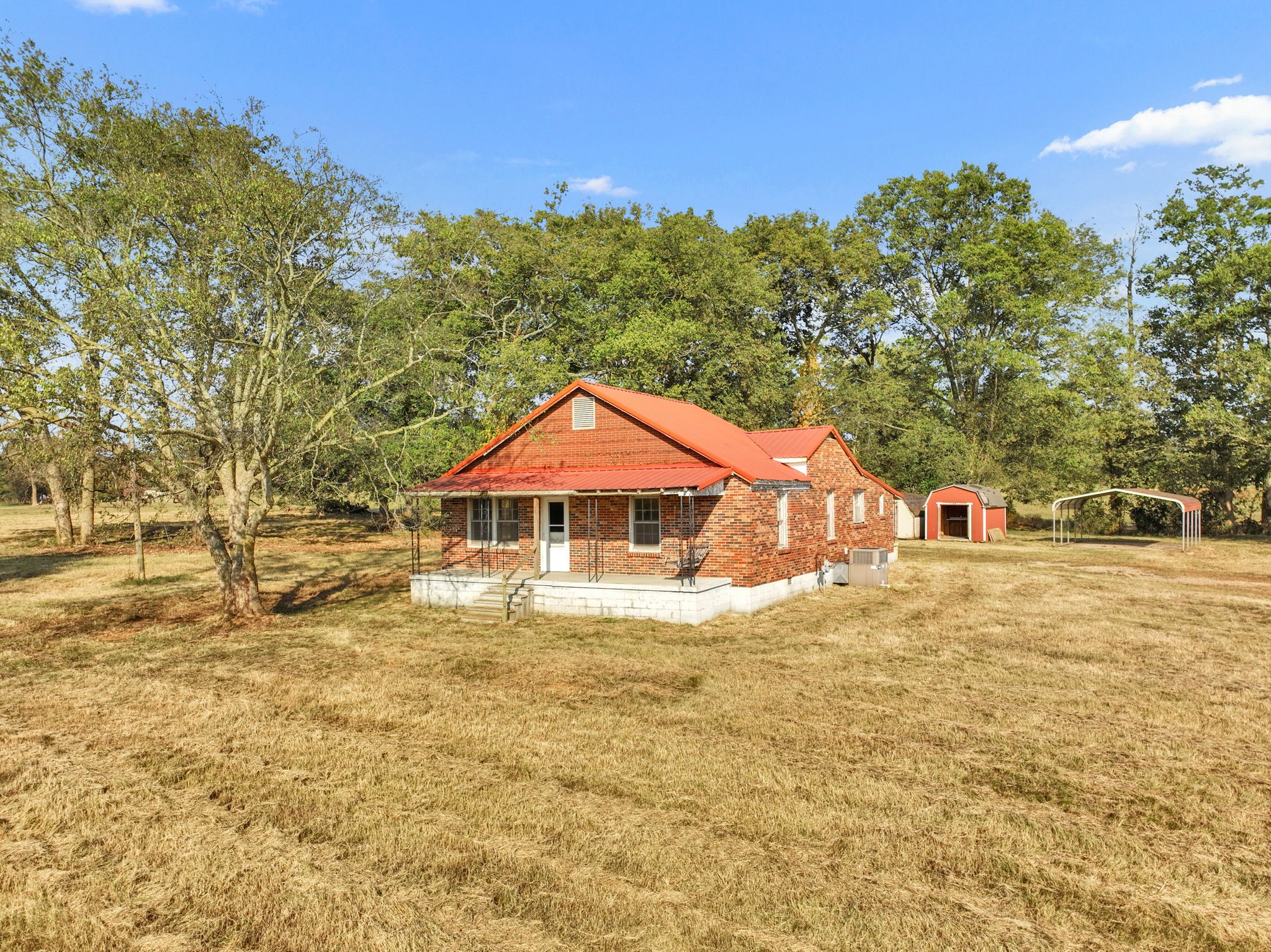 535 Scott Road Mount Pleasant, TN 38474 - Photo 30 of 40 a front view of a house with a yard and trees