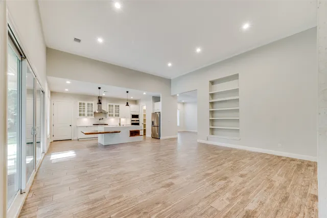 a view of a kitchen with wooden floor