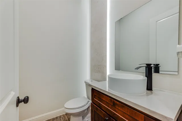 a bathroom with a sink a toilet and bathtub