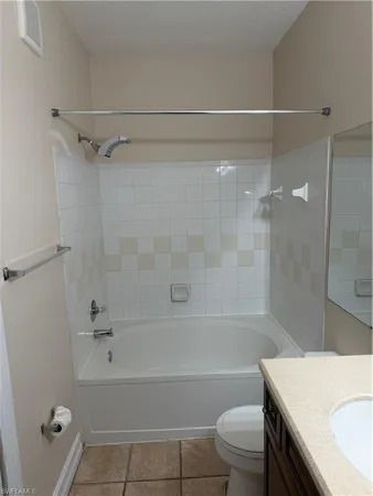 a bathroom with a sink a toilet and a bathtub
