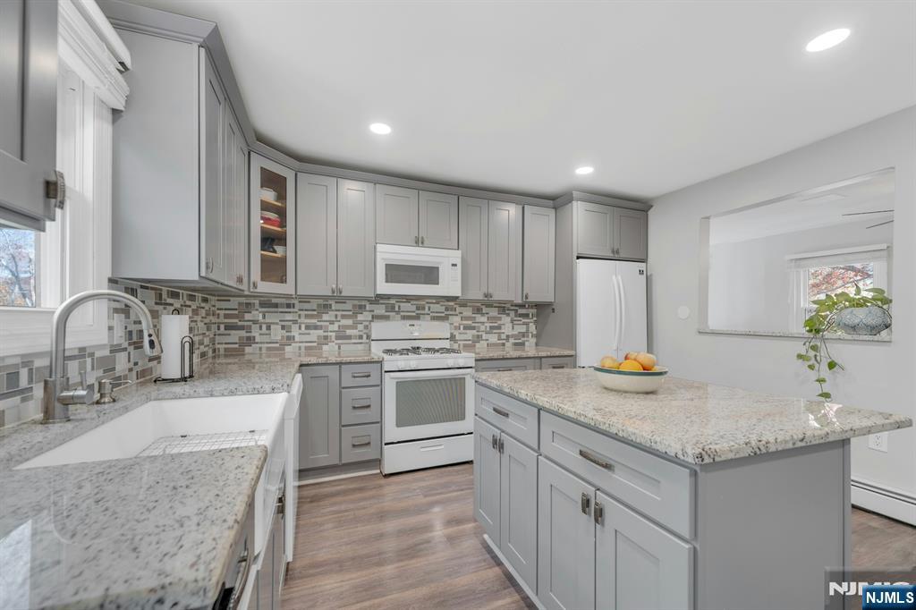 39 Delaware Road West Milford, NJ 07421 - Photo 16 of 37 a kitchen with a sink stove and cabinets