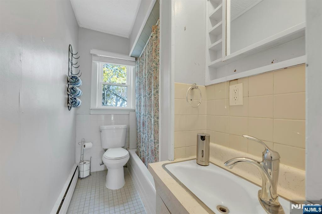 39 Delaware Road West Milford, NJ 07421 - Photo 20 of 37 a bathroom with a sink a toilet and a mirror