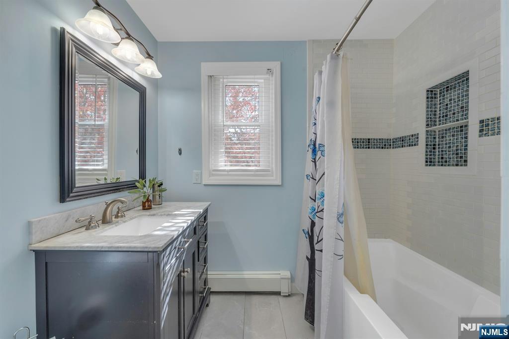 39 Delaware Road West Milford, NJ 07421 - Photo 22 of 37 a bathroom with a tub sink and mirror