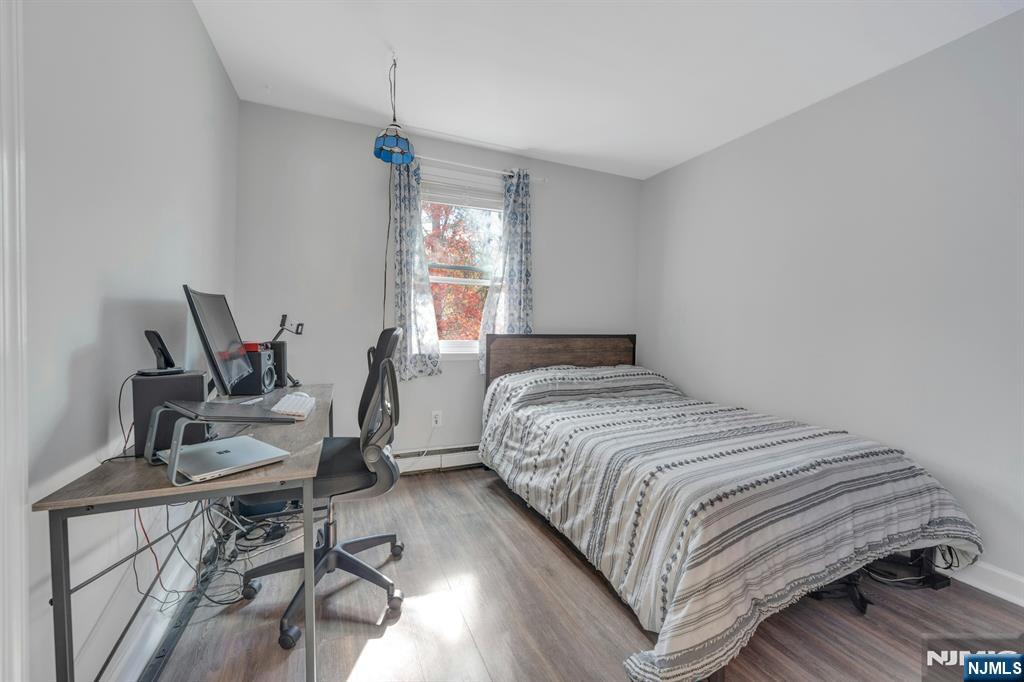 39 Delaware Road West Milford, NJ 07421 - Photo 23 of 37 a bedroom with a bed a desk and chair