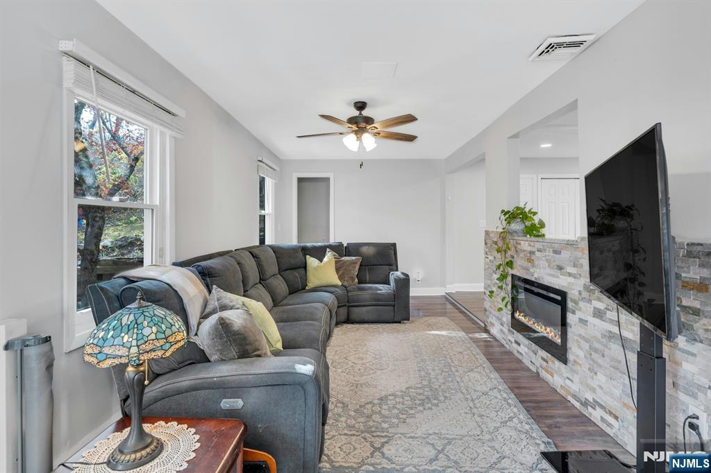 39 Delaware Road West Milford, NJ 07421 - Photo 8 of 37 a living room with furniture fireplace and flat screen tv