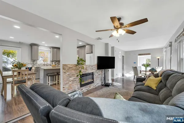 a view of a house with backyard and sitting area