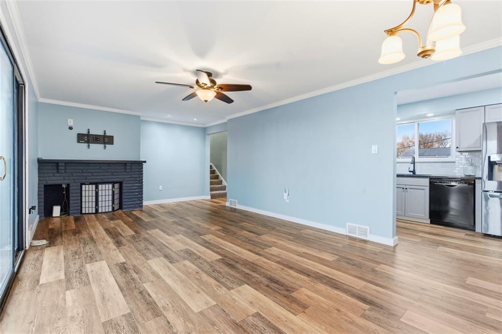 111 Crest Drive Monaca, PA 15061 - Photo 11 of 37 a view of a kitchen with a sink and a chandelier fan