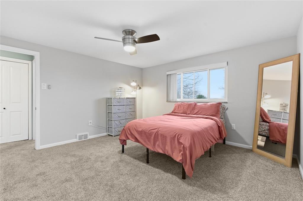 111 Crest Drive Monaca, PA 15061 - Photo 13 of 37 a spacious bedroom with a bed and a flat screen tv