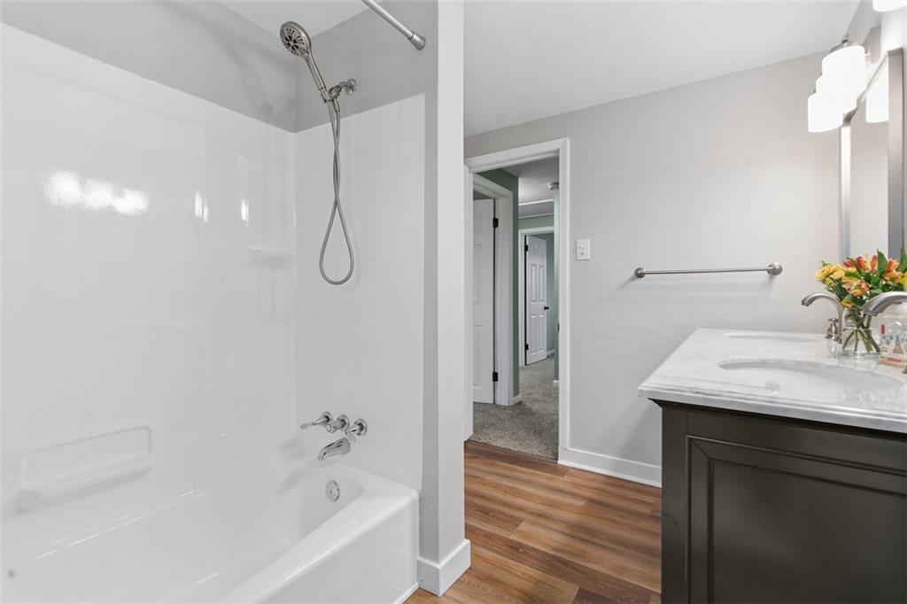 111 Crest Drive Monaca, PA 15061 - Photo 20 of 37 a bathroom with a granite countertop sink a mirror and shower