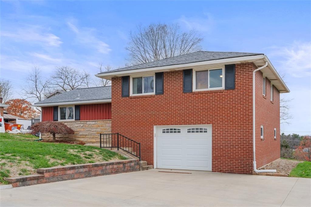 111 Crest Drive Monaca, PA 15061 - Photo 2 of 37 a front view of a house with garden