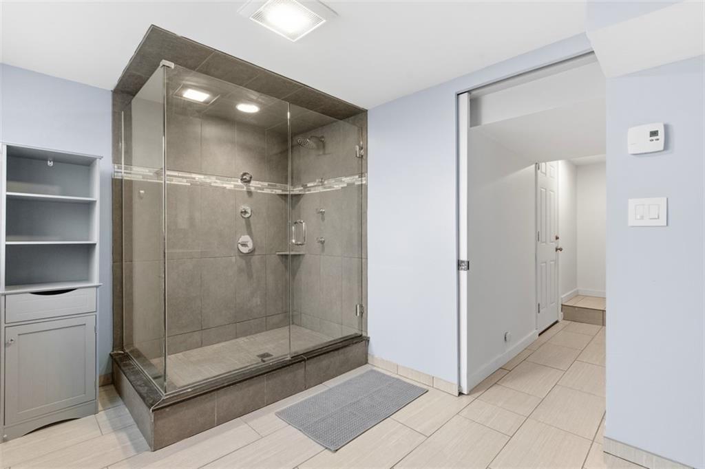 111 Crest Drive Monaca, PA 15061 - Photo 28 of 37 a bathroom with a shower and a mirror