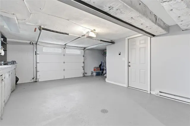 a roof deck view with table and chairs