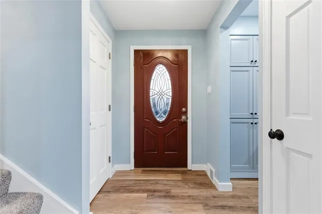 a view of entryway with wooden floor