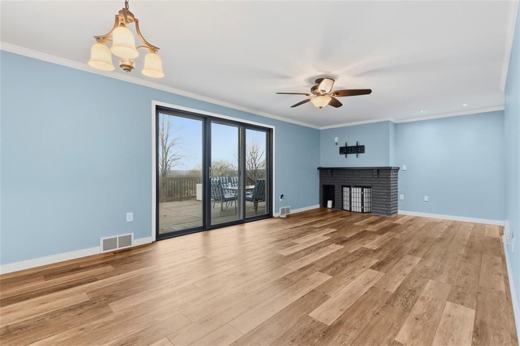111 Crest Drive Monaca, PA 15061 - Photo 10 of 37 a view of empty room with wooden floor and fan