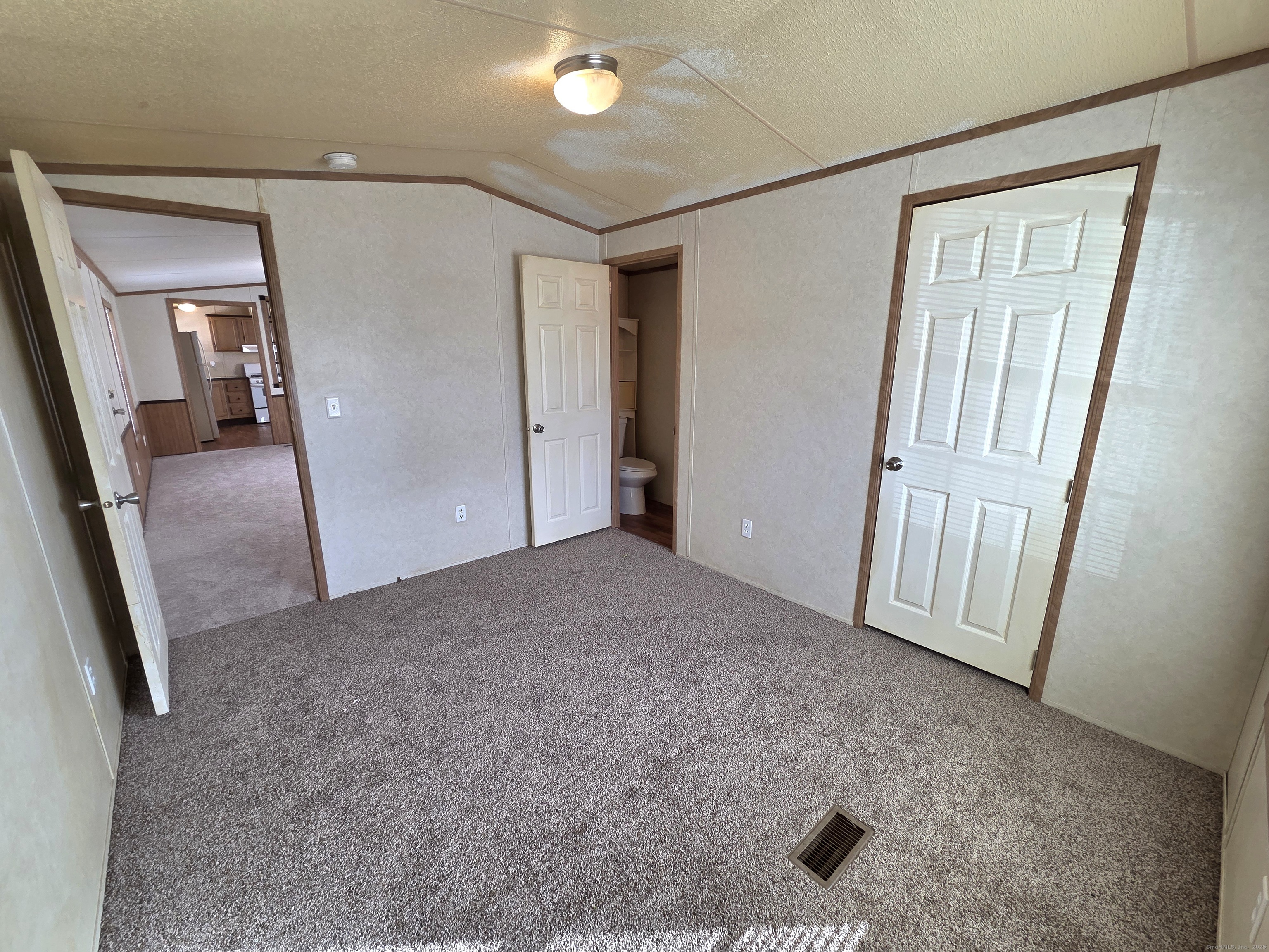 9 N Road, Unit 17 East Windsor, CT 06088 - Photo 12 of 24 an empty room with windows