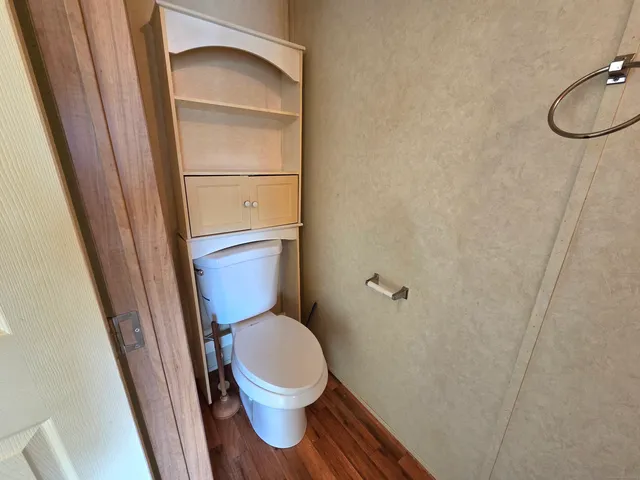 a bathroom with a toilet and a sink