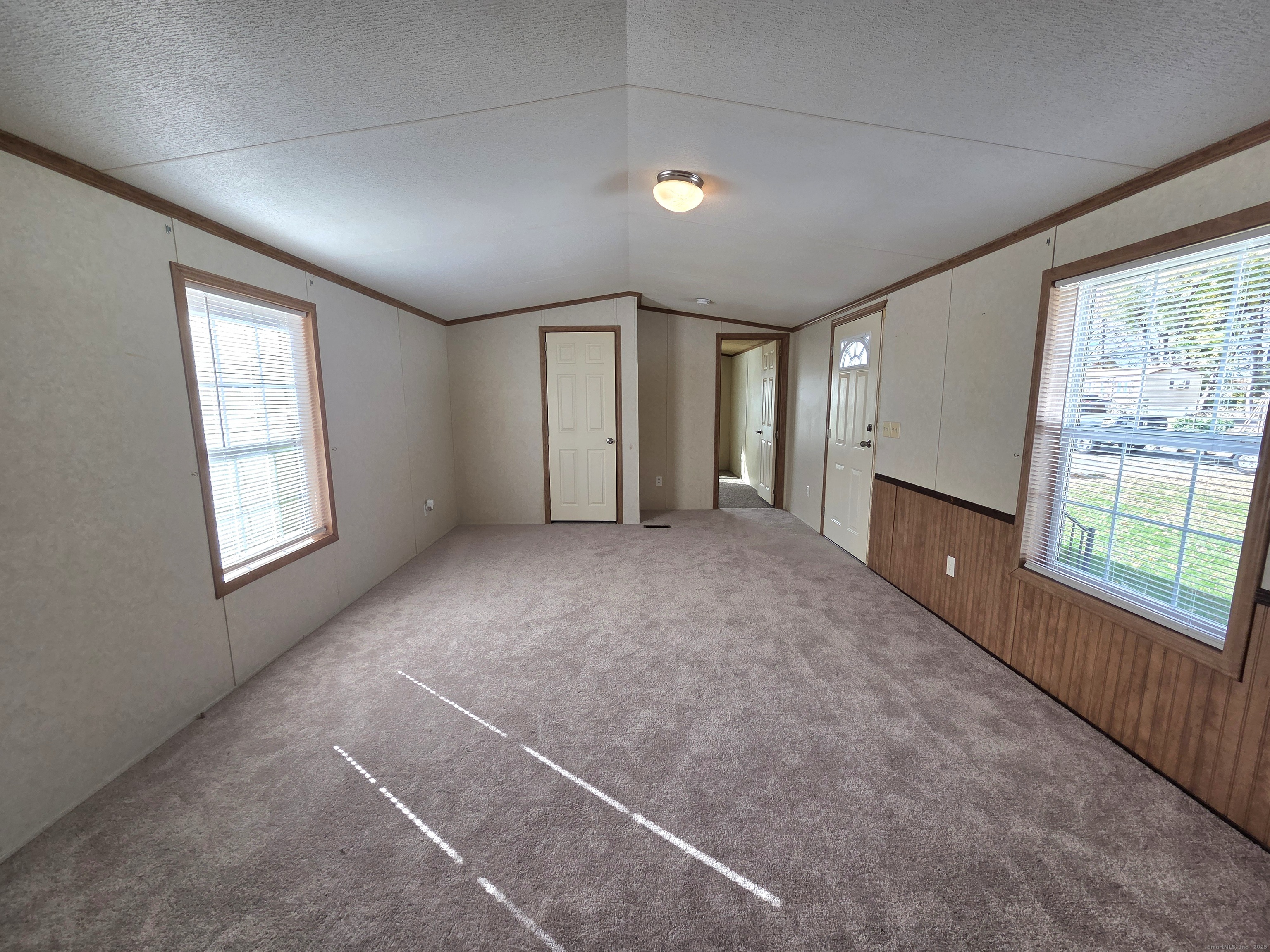 9 N Road, Unit 17 East Windsor, CT 06088 - Photo 2 of 24 an empty room with windows