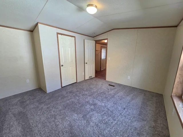 an empty room with a empty space and a window