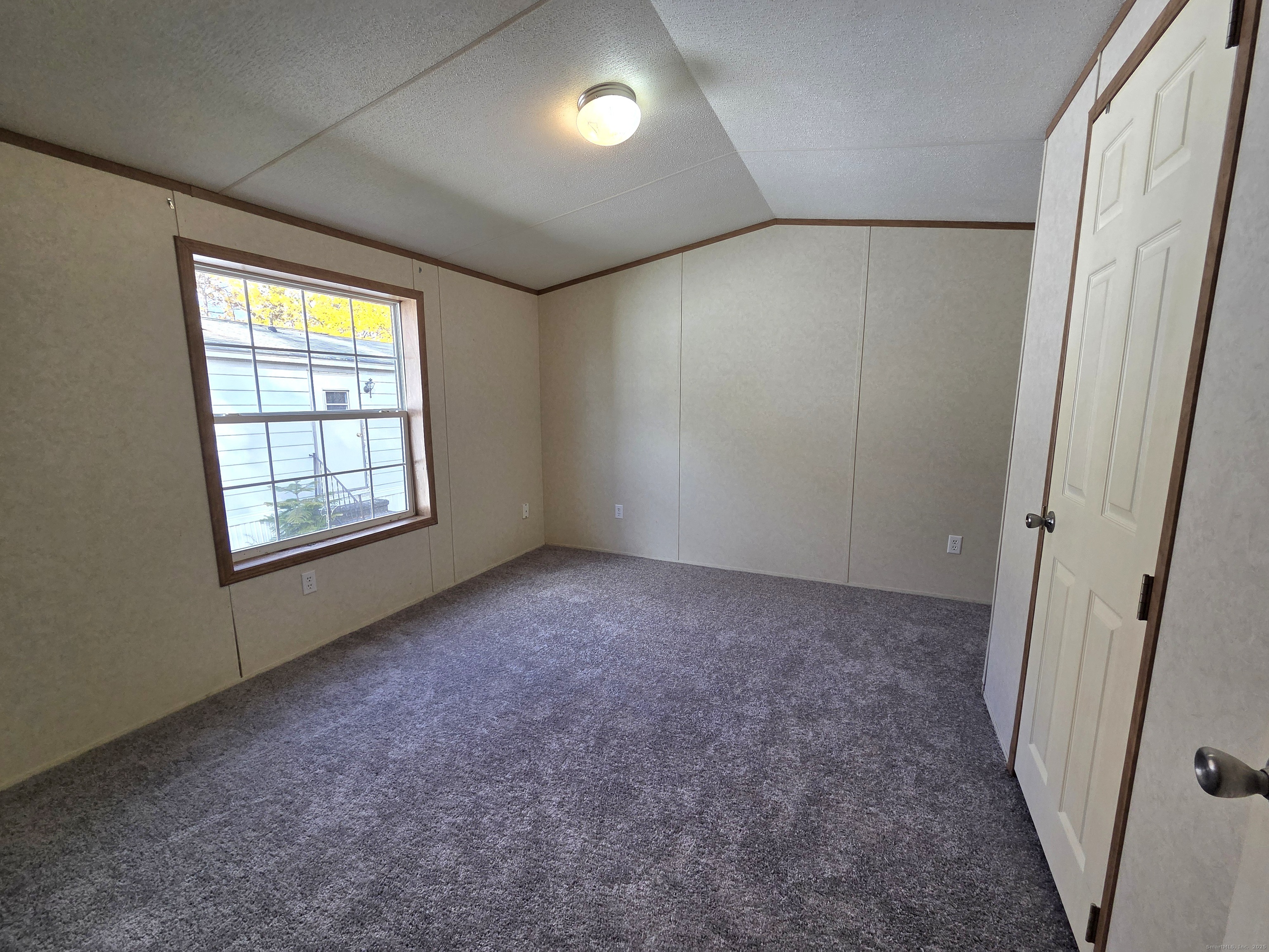 9 N Road, Unit 17 East Windsor, CT 06088 - Photo 3 of 24 an empty room with windows
