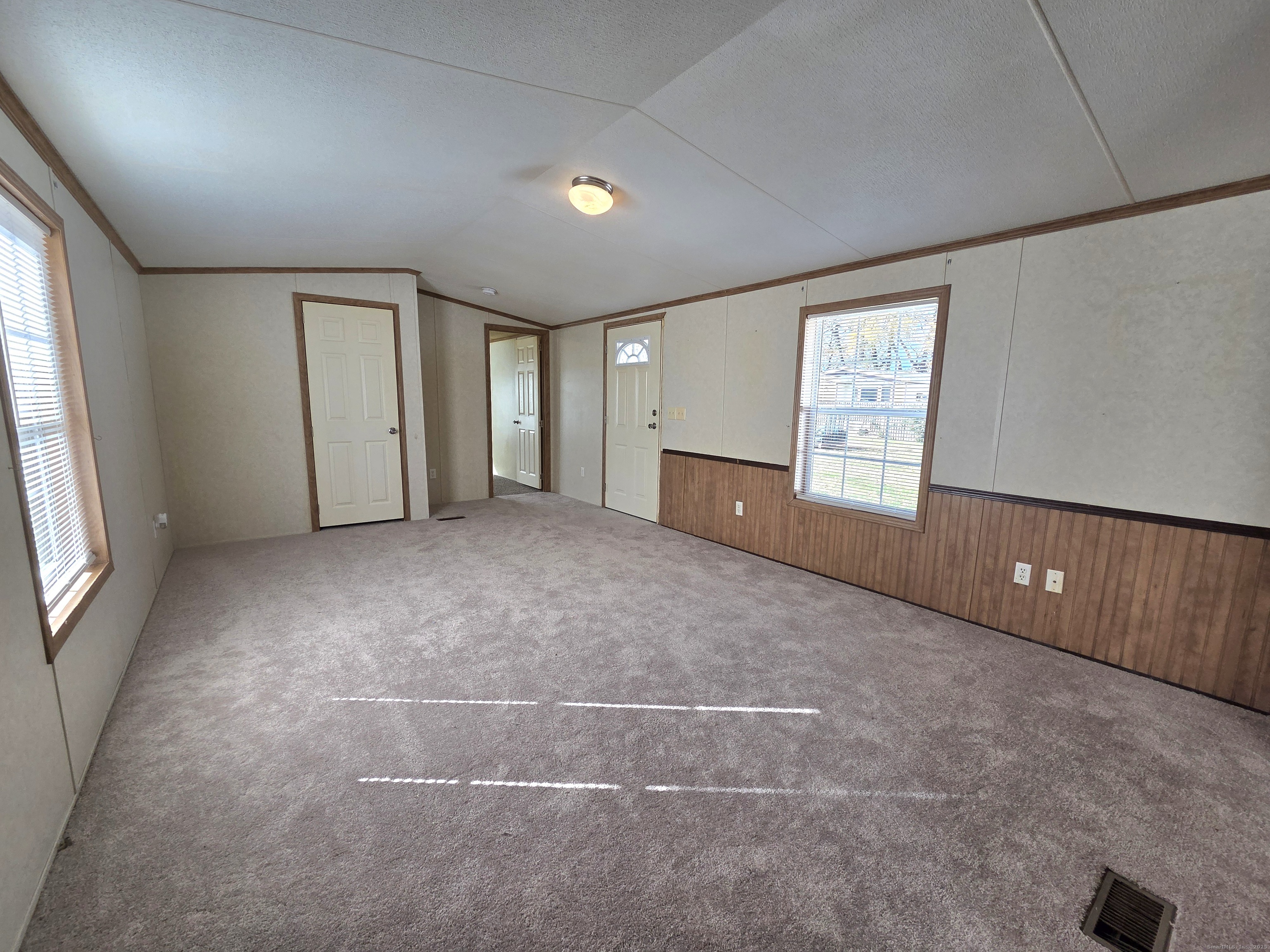 9 N Road, Unit 17 East Windsor, CT 06088 - Photo 4 of 24 a view of an empty room with a window