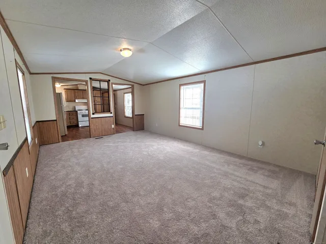 a view of a livingroom with furniture hardwood floor and a window