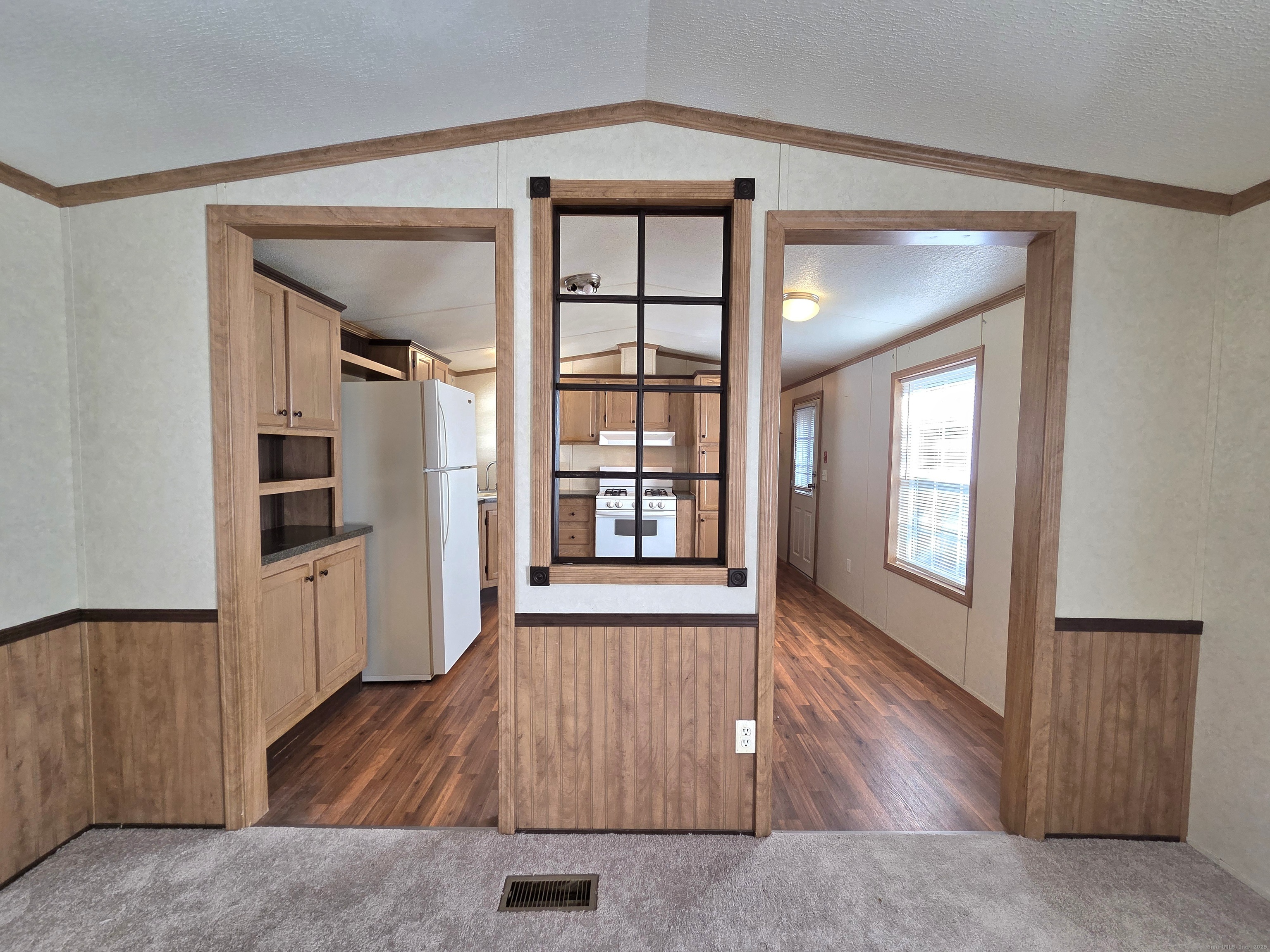 9 N Road, Unit 17 East Windsor, CT 06088 - Photo 7 of 24 an empty room with wooden floor and windows