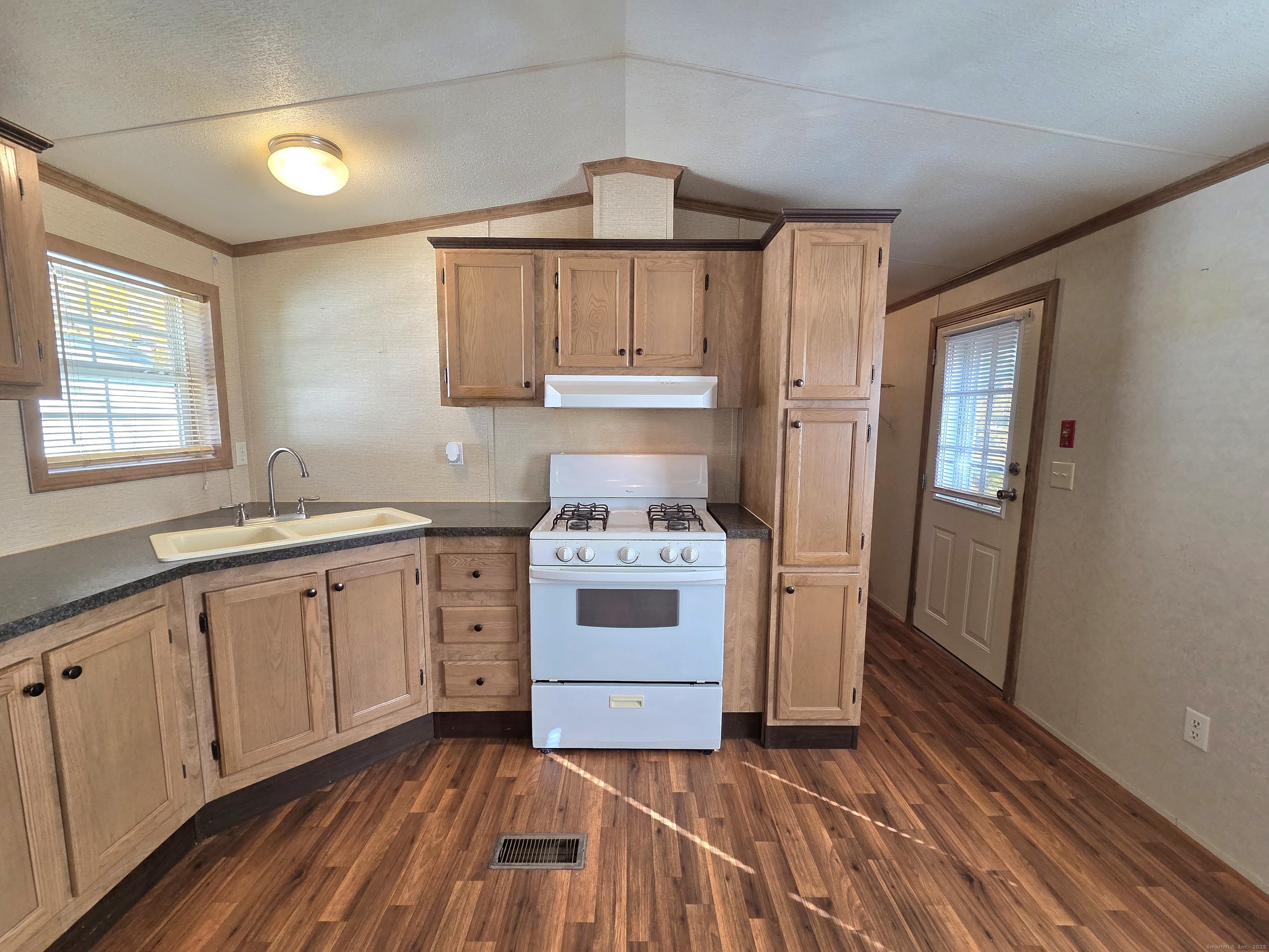 9 N Road, Unit 17 East Windsor, CT 06088 - Photo 10 of 24 a kitchen with a stove cabinets and a sink