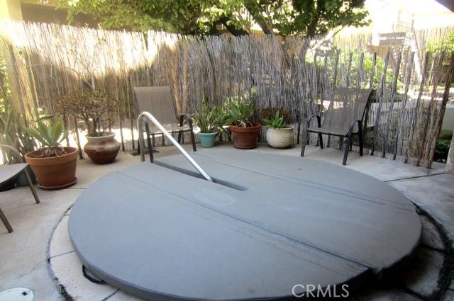 6675 Mission Gorge Road, Unit A114 San Diego, CA 92120 - Photo 21 of 26 a view of a patio with couple of chairs and a fountain