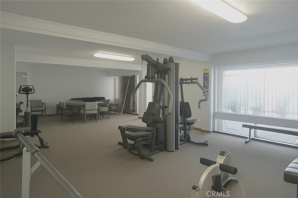 6675 Mission Gorge Road, Unit A114 San Diego, CA 92120 - Photo 23 of 26 a view of a room with gym equipment