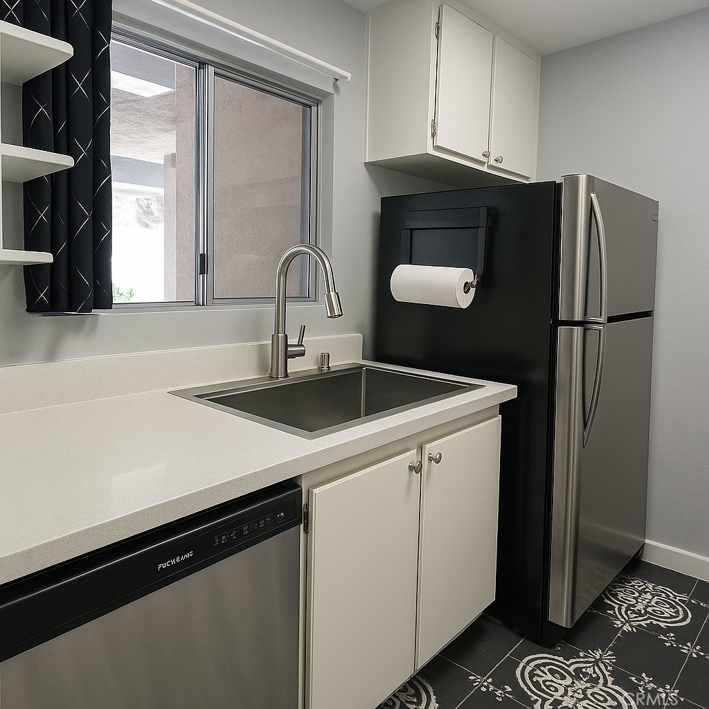 6675 Mission Gorge Road, Unit A114 San Diego, CA 92120 - Photo 6 of 26 a kitchen with a sink and a refrigerator
