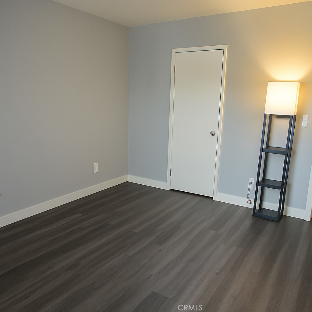 6675 Mission Gorge Road, Unit A114 San Diego, CA 92120 - Photo 10 of 26 a view of empty room with wooden floor and window