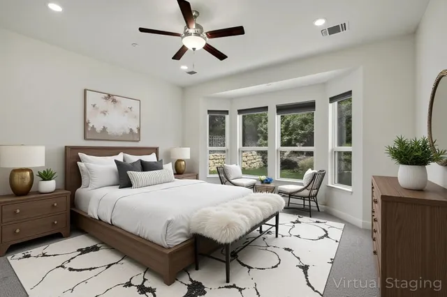 a bedroom with a large bed and a window