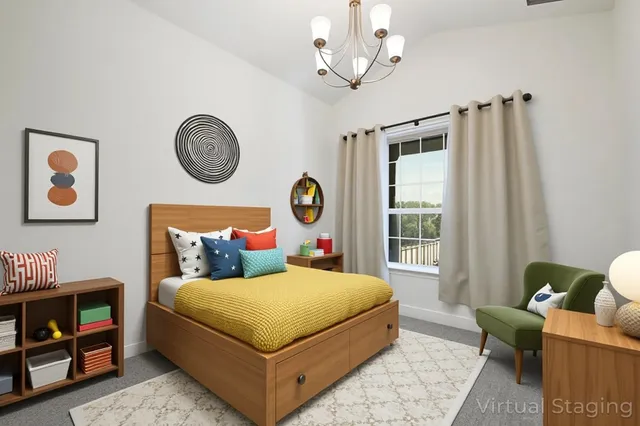 a bedroom with a bed chandelier and a window