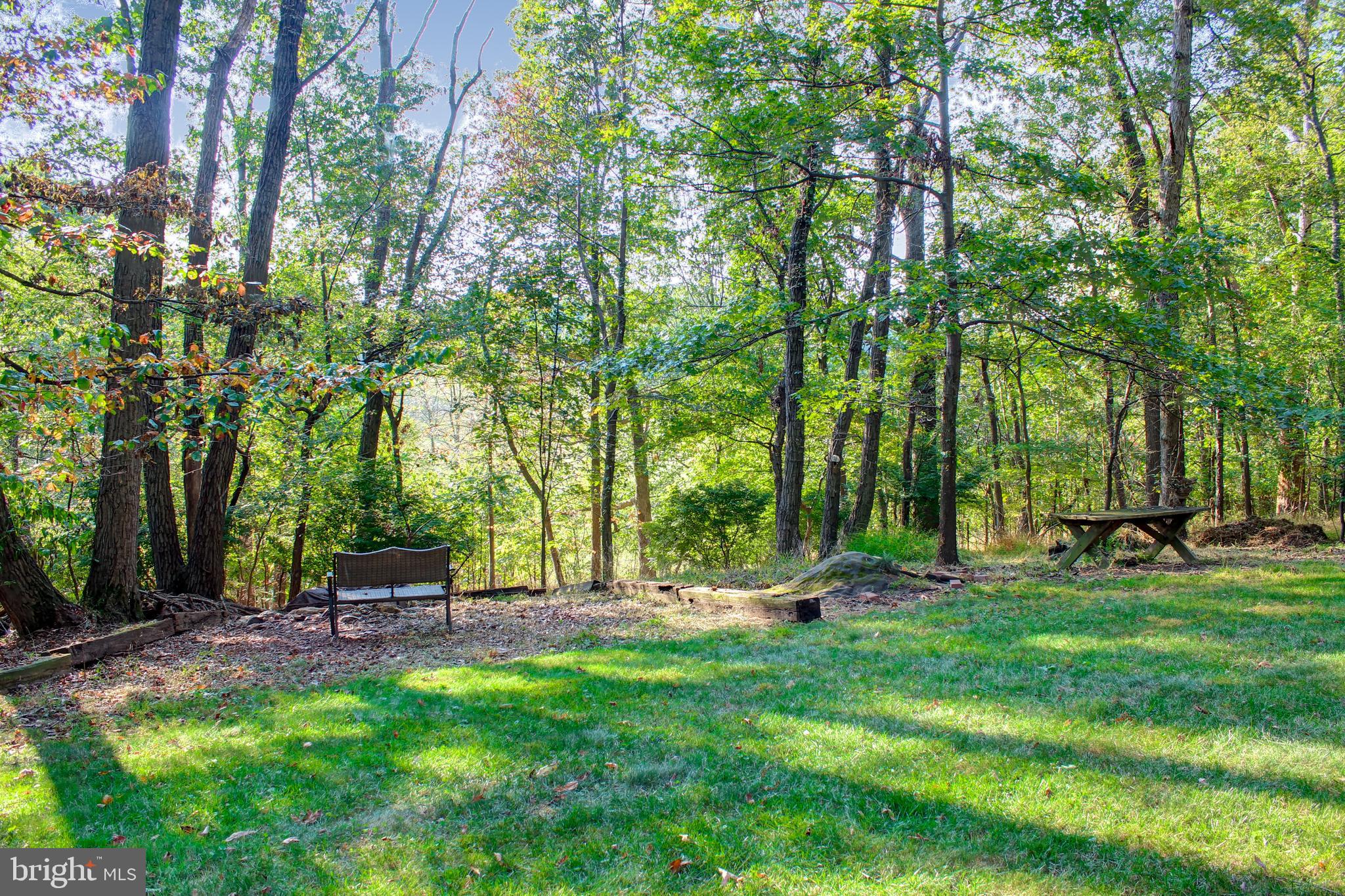 4934 Fleming Road Mount Airy, MD 21771 - Photo 29 of 42 Bench in backyard overlooking miles of tranquility