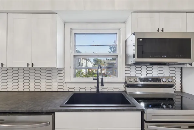 a kitchen with a stove and a microwave
