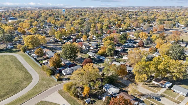 a view of a playground with basketball court