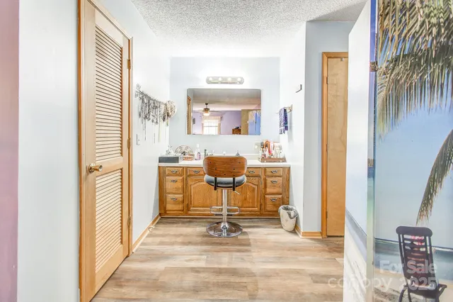 a view of living room with furniture and a window