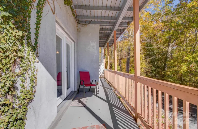 a view of balcony with furniture
