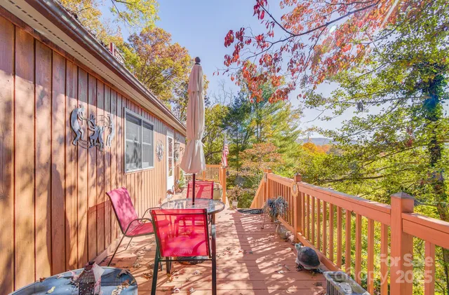 a view of a chairs and table in the balcony