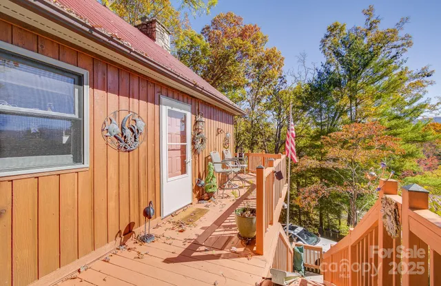 a view of a house with a door and wooden walls
