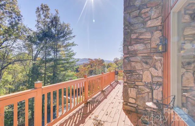 a balcony with trees in front of it