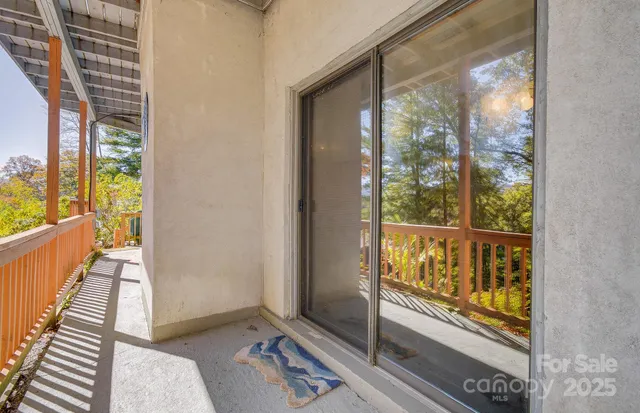 a view of a balcony with wooden floor